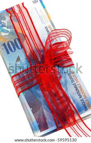 Swiss francs with a red bow gift of money
