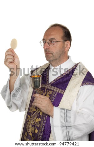 a catholic priest during communion in worship