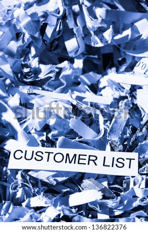 scraps of paper with the word customer list, photo icon for data destruction, data protection and customer data