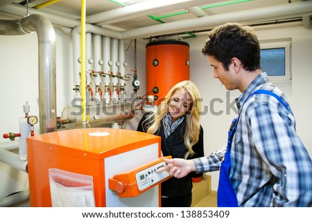 young heating engineer in boiler room for heating system