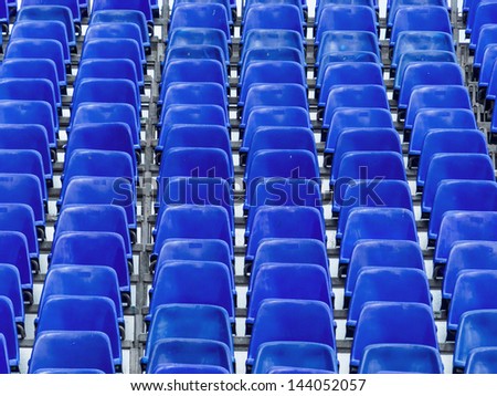 grandstand with blue chairs, symbolic photo for background, events, infrastructure