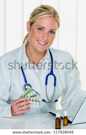 a young doctor at the surgery in their medical practice.