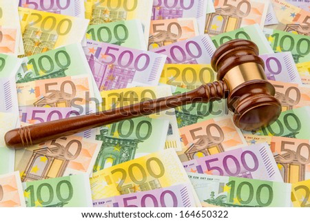 judge gavel and euro banknotes. symbolic photo for costs in court of law and auctions