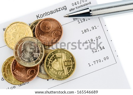 the bank statement and some coins of euro currency