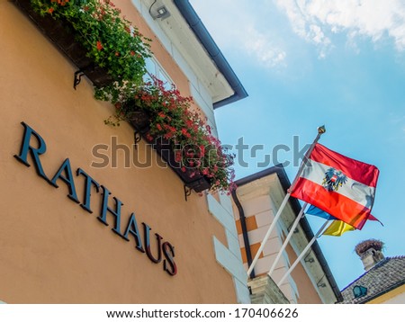 a town hall in austria with the austrian flag