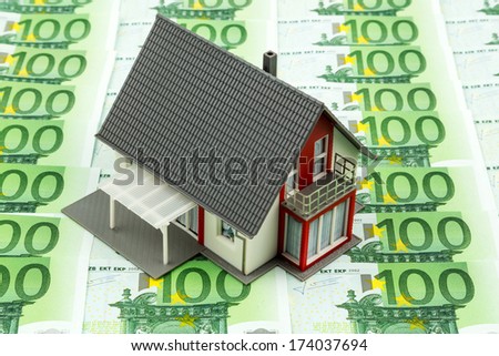 residential house on banknotes, symbolic photo for home purchase, financing, building society