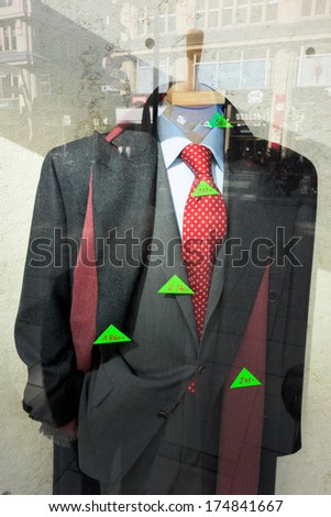 expensive clothing in a shop window of a gentlemen\'s outfitter