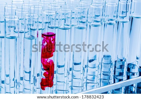 many test tubes for an experiment in a research laboratory of a university. learning and researching symbolic photo for.