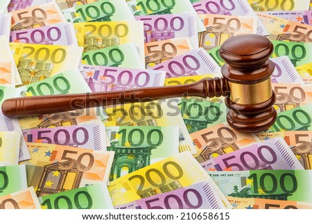 judge gavel and euro banknotes. symbolic photo for costs in court of law and auctions