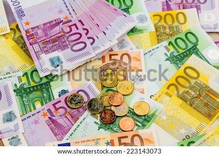 many different euro bills. symbol photo for wealth and investment.