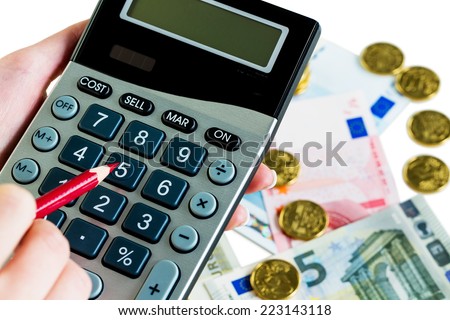 hand with calculator and bills. symbol photo for sales, profits, taxes and costing