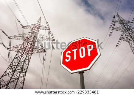 a poles of a power line and a stop sign. photo icon for phasing out nuclear energy