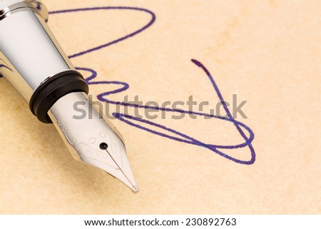 a signature and a fountain pen on yellow paper. photo icon for contract testament and graphology