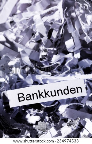 shredded paper tagged with bank customers, symbolic photo for data destruction, customer data and bank secrecy