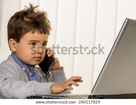 little boy on a laptop, symbol of the internet, e-commerce, consumer behavior