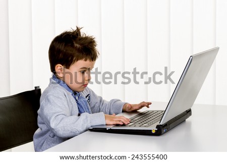 little boy at computer, internet icon, e-commerce, consumer behavior