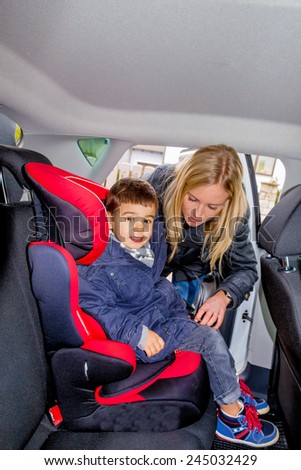 boy in a car seat, symbol of protection, care, vehicle safety