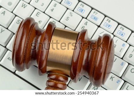 gavel on computer keyboard, symbolic photo for e-commerce and consumer protection