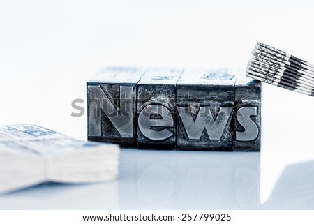 the word news written with lead letters. photo icon for newsletters, newspapers and information