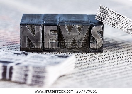 the word news written with lead letters. photo icon for newsletters, newspapers and information