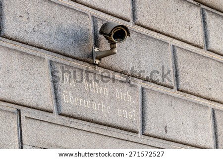 surveillance camera on a building, symbol of monitoring, home security, control, data protection