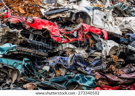old cars were scrapped in a trash compactor. scrap iron and scrapping premium for car wrecks