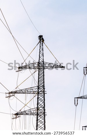 workers on electricity poles. a new power line will be built