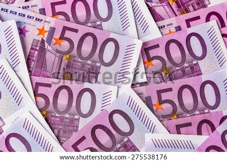 many five hundred euro banknotes are adjacent. symbolic photo for wealth and investment