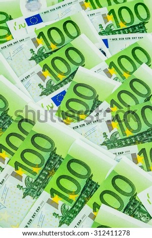 many einhhundert euro banknotes are adjacent. symbolic photo for wealth and investment