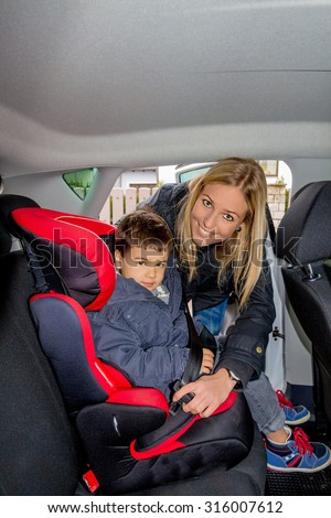 boy in a child seat, a symbol of protection, care, vehicle safety