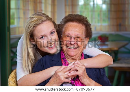 a grandson to visit his grandmother. fun and pleasure in the embrace. Stock foto © 
