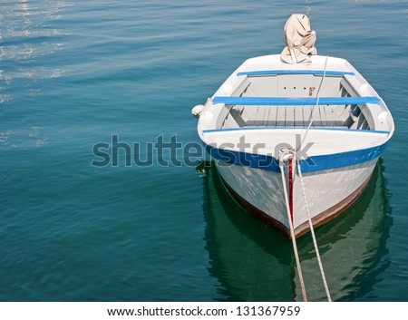 Similar – Boats on small part of seashore washing by foamy waves