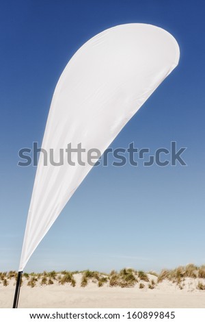 modern beach flag at a beach (northsea) - nice background with space for text