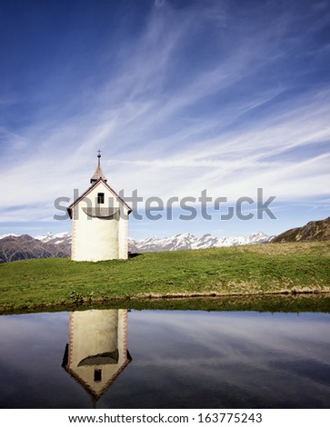 Similar – Image, Stock Photo Reflection of a church tower and houses in the water