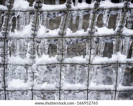 icicles at a wire mesh - background pattern