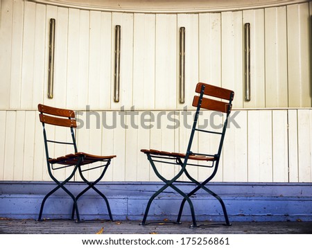 two folding chairs at a pavillion