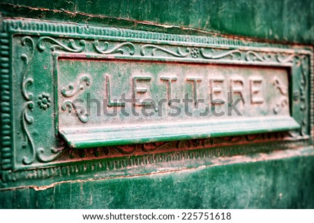 old mail slot at a door