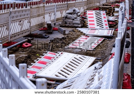 Similar – Image, Stock Photo red-white barrier beacons in front of a richly decorated but slowly decaying residential house with yellow-brown clinker facade from the Gründerzeit / dilapidated / lost place