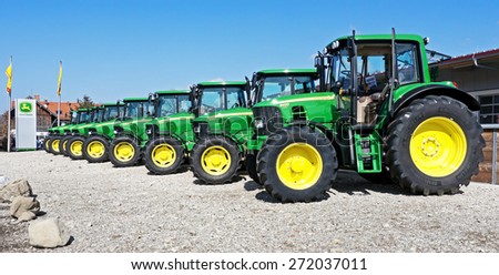 MUNICH, GERMANY - MARCH 20 - John Deere Model 6430 - new tractors at a front yard at March 20, 2012 near munich - germany