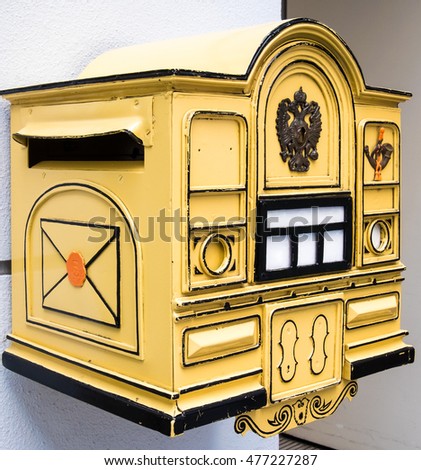 Similar – Image, Stock Photo old, pasted mailbox slot with a flap that says “LETTERS”, made of metal in an old wooden door, where the brown paint is peeling off / write letter / e-mail / mailbox company