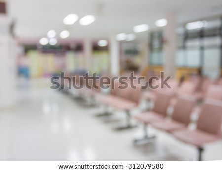 Blur row of waiting seat zone and walkway in hospital for background