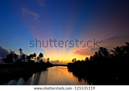 Wonderful sunset on Tangalla backwaters, Sri Lanka, high contrast effect on light rays