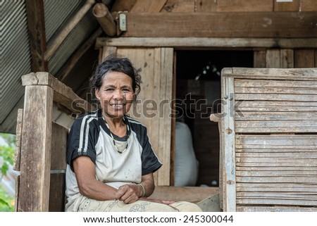 Balla Peu, Sulawesi, Indonesia - August 18, 2014: Portrait of a poorly dressed woman of Toraja ethnicity in the traditional village of Balla Peu, Mamasa region, West Tana Toraja, Sulawesi, Indonesia.