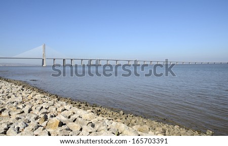 LISBON, PORTUGAL - AUGUST 13:  Vasco da Gama Bridge on August 13, 2013 in  the Park of the Nations  in Lisbon, Portugal. It is the longest bridge in Europe. It was opened to traffic  for Expo 98.