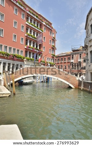 VENICE, ITALY - AUGUST 11: Several people on  a bridge of the district of Santa Croce district  on August 11, 2014 in Venice, Italy