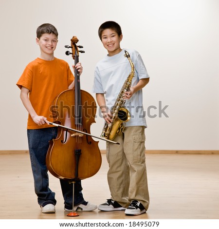 Musicians standing with cello and saxophone