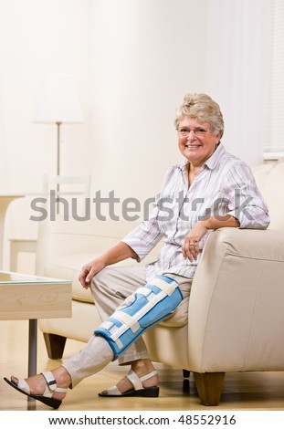 Senior woman wearing knee brace