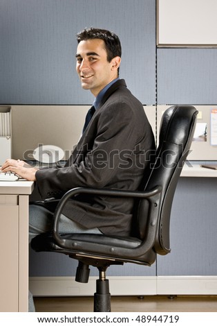 Businessman typing on computer at desk