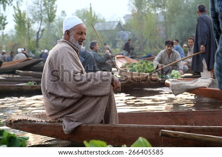 SRINAGAR INDIA April 15, 2013: Negotiating for good price can see at floating market every morning in DAL lake.