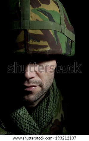 British Soldier With Face In Shadow